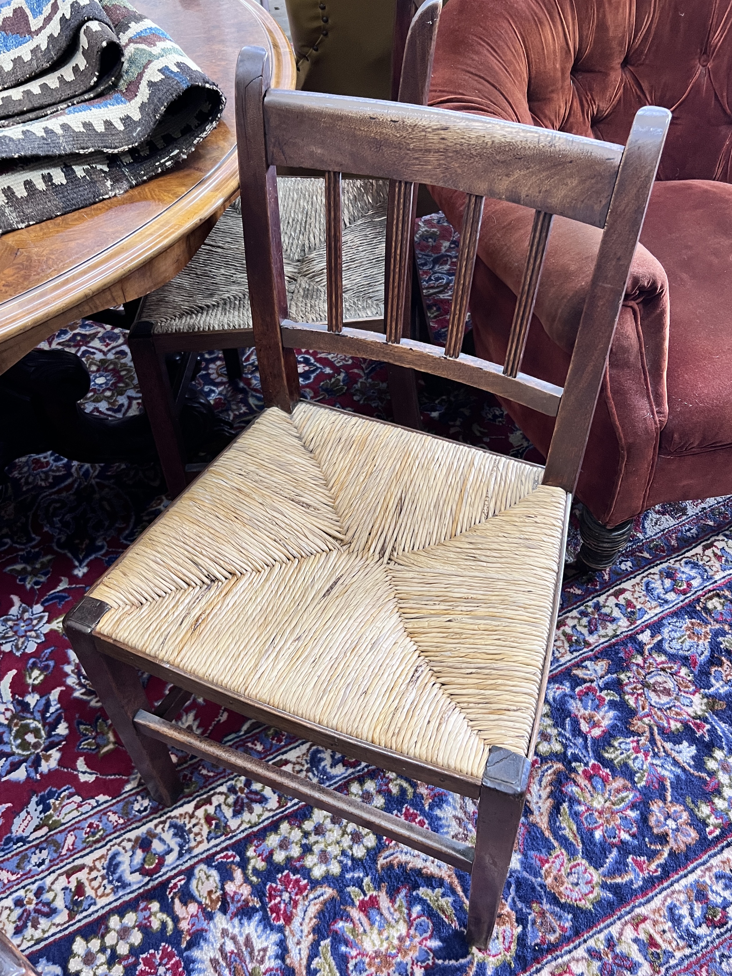 A set of six 19th century provincial mahogany rush seat dining chairs